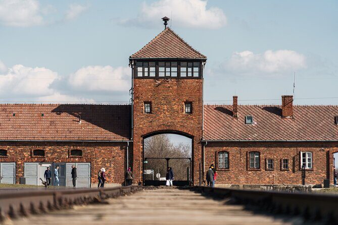 Auschwitz-Birkenau Memorial Entrance Ticket and Guided Tour - Auschwitz I: passing through Arbeit Macht Frei and the camp’s original core
