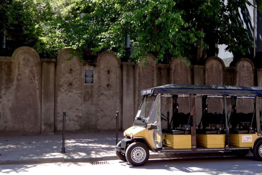 Krakow: Jewish Quarter and Former Ghetto Tour by Golf Cart - Eagle Pharmacy and the ghetto wall fragments you pass by