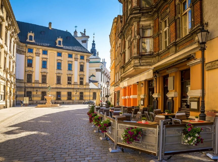 Krakow: Traditional Street Food Walking Tour - Old Town snack stops: pierogi, zapiekanka, obwarzanek, and the vodka shot