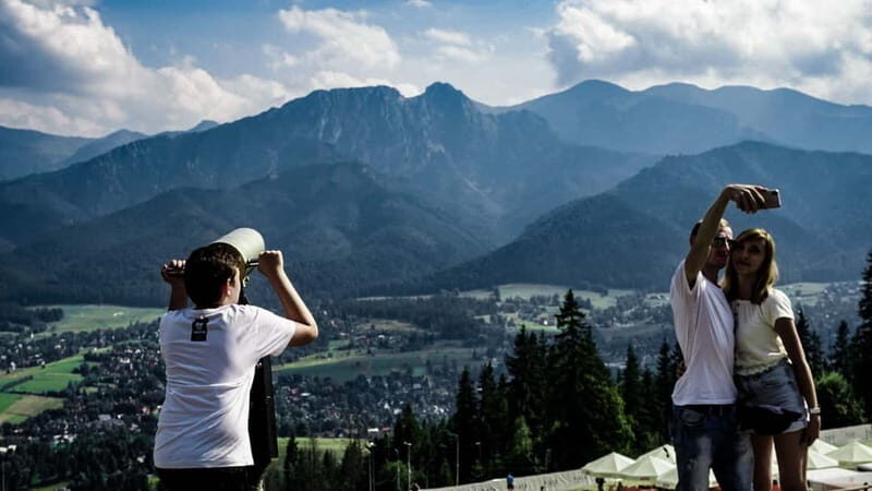 Krakow: Zakopane Cable Car, Spirits, Tasting & Thermal Baths - Zakopane center and Krupowki Street: markets, snacks, and breathing room